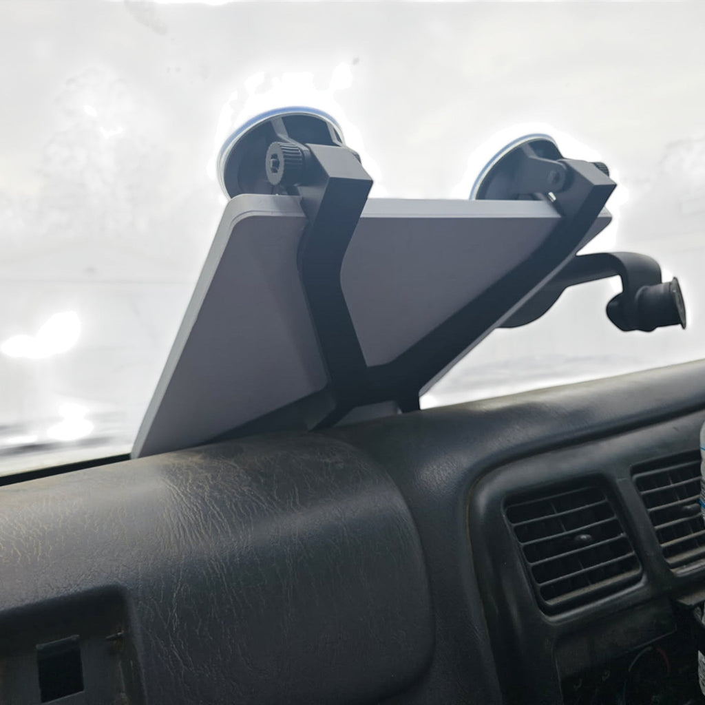 Get Mounted dash suction mount holding a Starlink Mini on a vehicle windshield for mobile internet connectivity.
